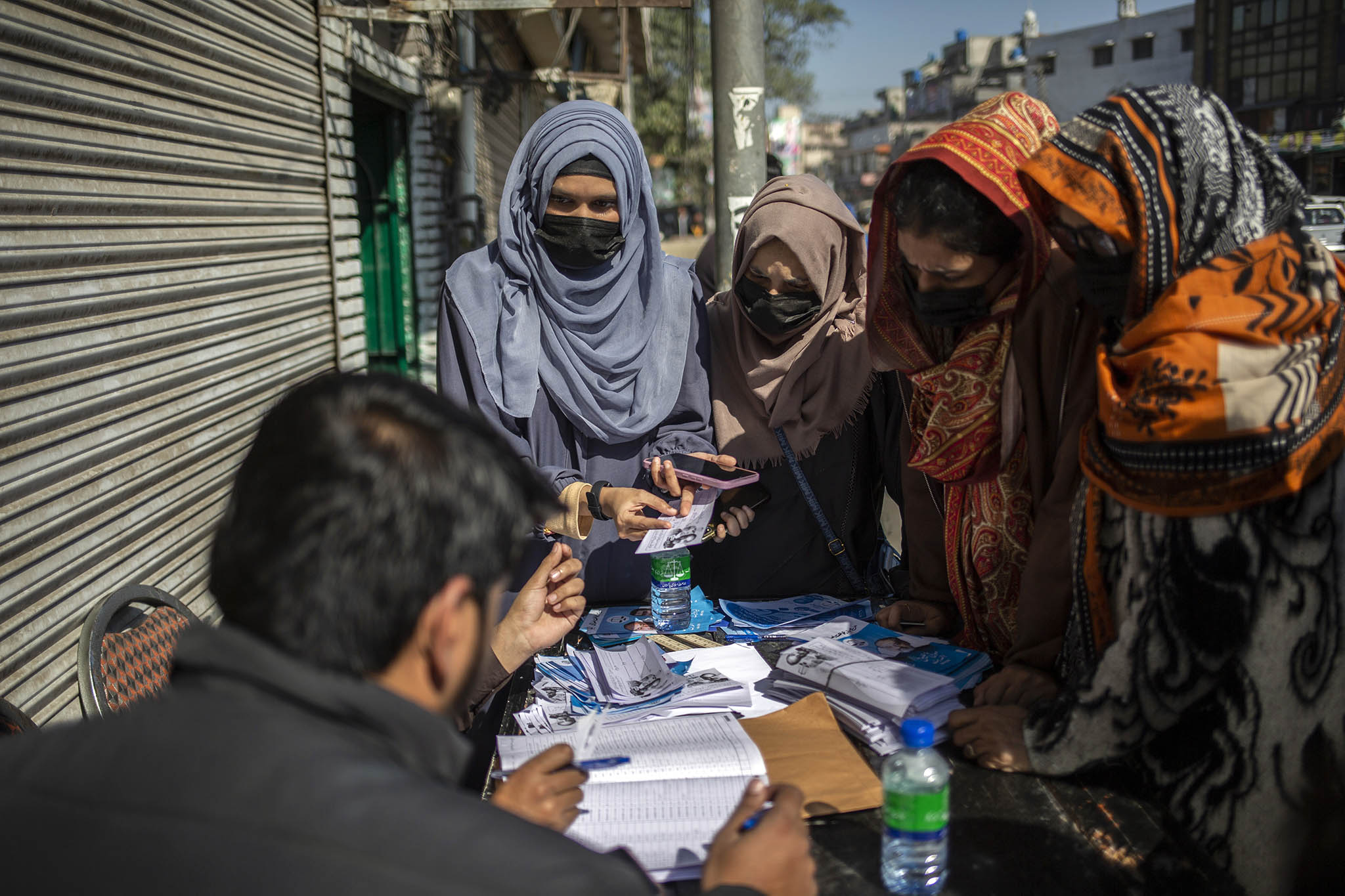 Women gather at a candidate’s booth in Lahore, Pakistan, on Feb. 8, 2024, the day of Pakistan’s general election. (Saiyna Bashir/The New York Times)