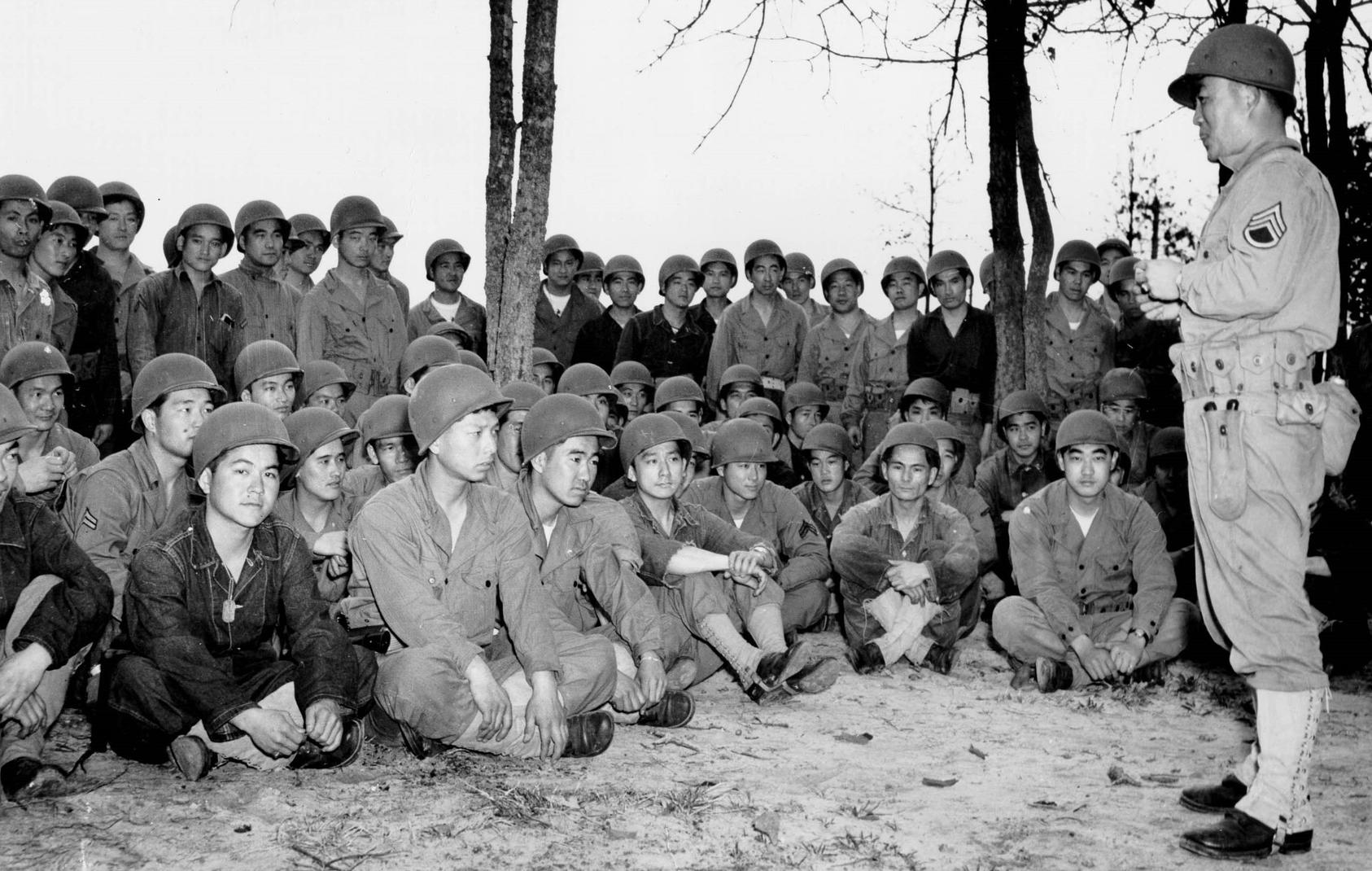 Japanese-American troops of the Army’s 100th Infantry Battalion gather during training in 1943. Lieutenant Spark Matsunaga helped lead the battalion into World War II combat in Italy. (U.S. Army)
