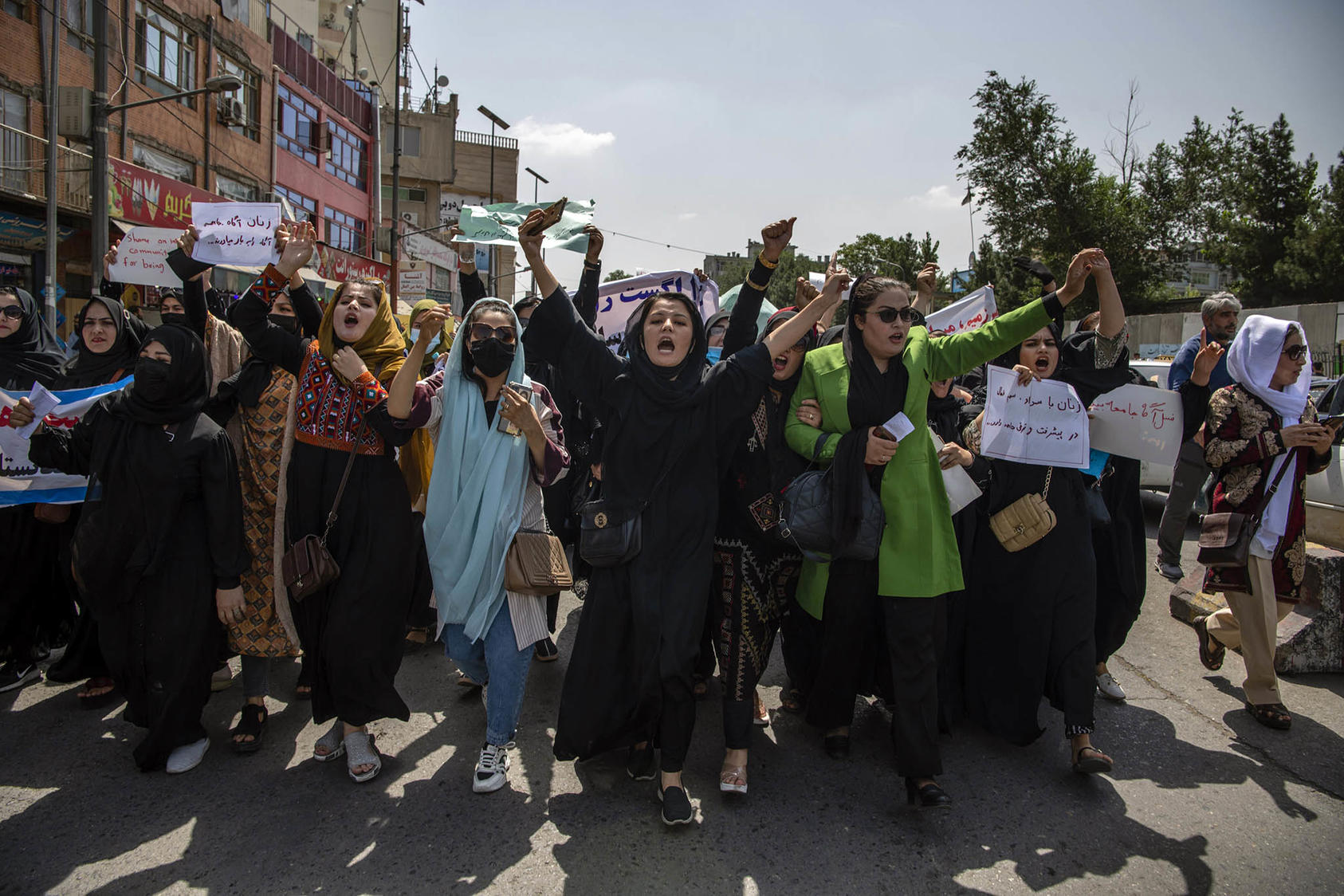 Afghan women protest Taliban rule in Kabul in August before gunmen dispersed them with gunfire into the air. Women have continued to resist a gradually tightening Taliban crackdown against them. (Kiana Hayeri/The New York Times)