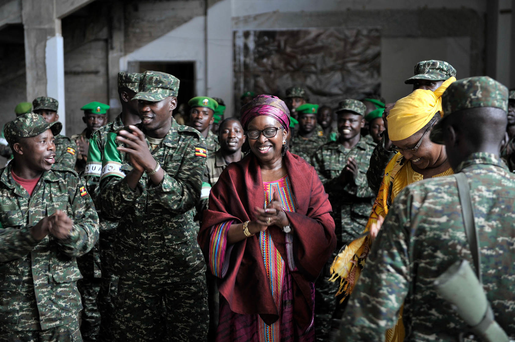 AU Special Envoy for Women, Peace and Security Bineta Diop dances with African Union soldiers at Mogadishu Stadium in Somalia on November 27, 2014 (AMISOM Public Information/Flickr)